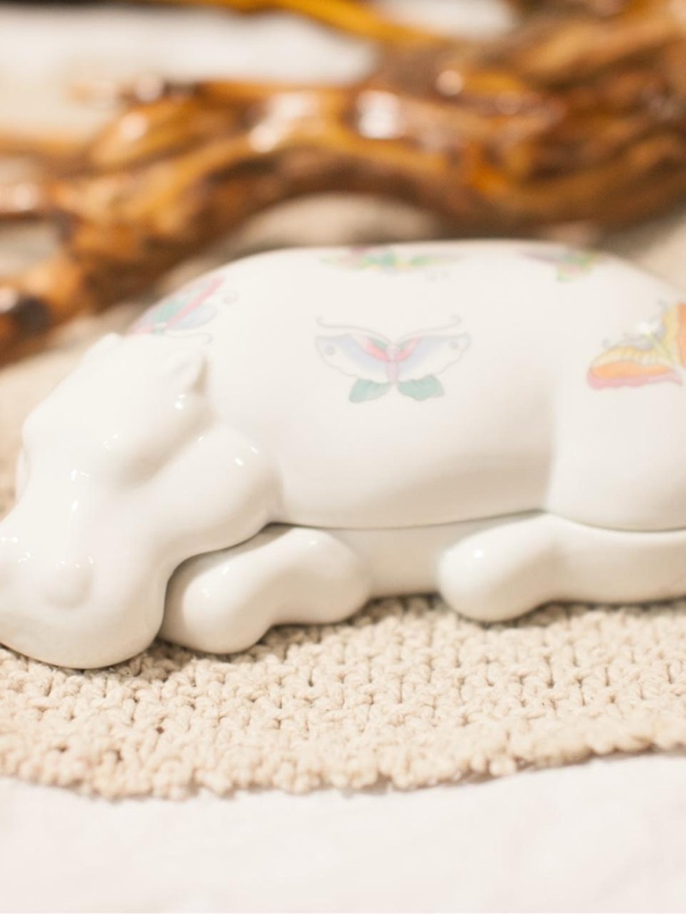Ceramic Sleeping Hippo Figurine with Butterfly Accents - White